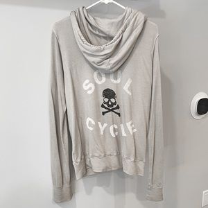 SoulCycle zip-up sweatshirt with black and white skull/ text on the back